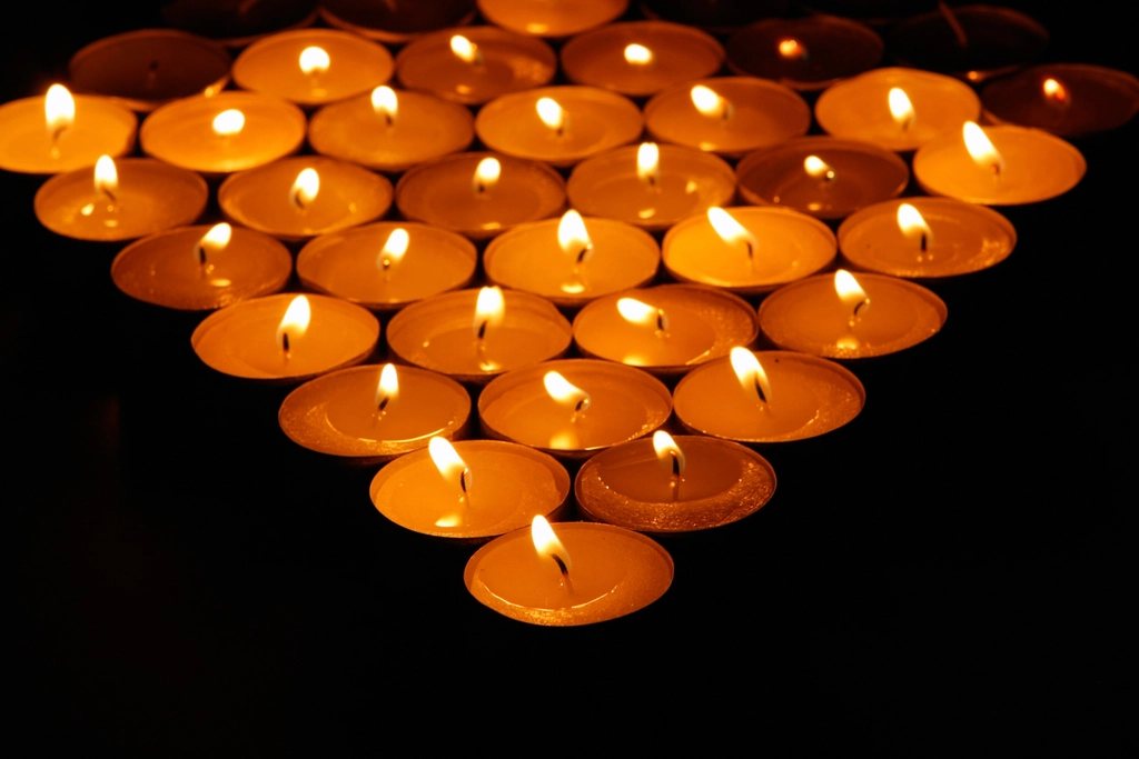 Rows of lit candles